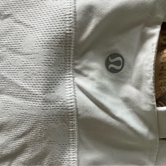 Lululemon white athletic top with detailing and pocket in the back. - Picture 4 of 4